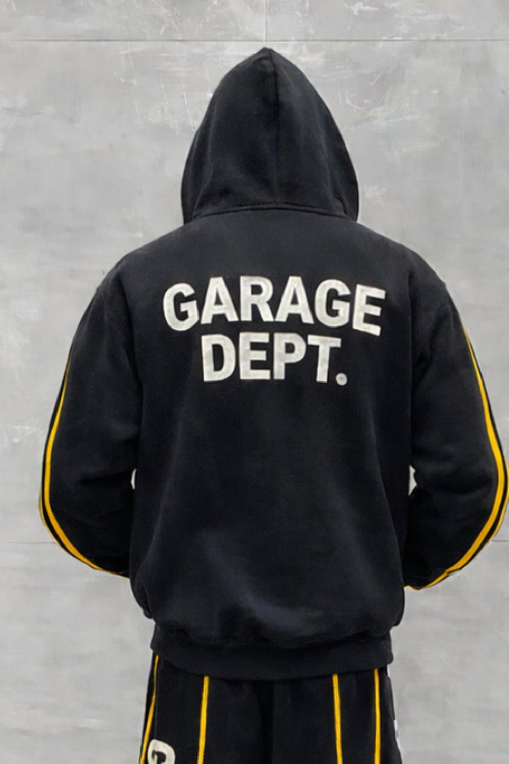Stepz Garage Dept. tracksuit worn on model